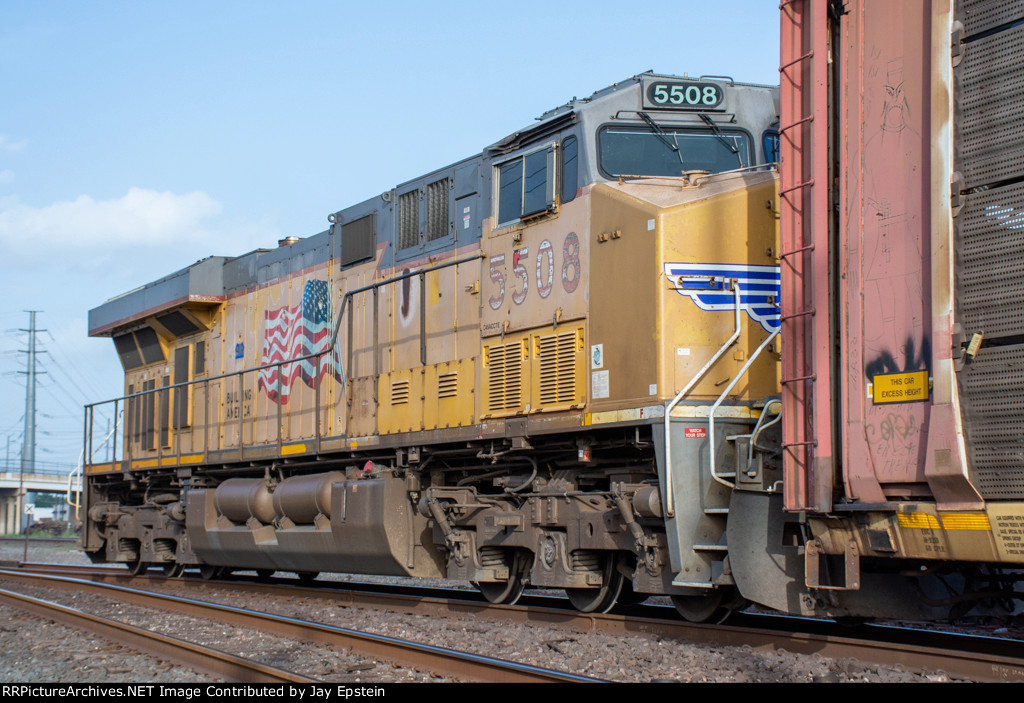 UP 5508 shoves hard on the rear of a westbound manifest